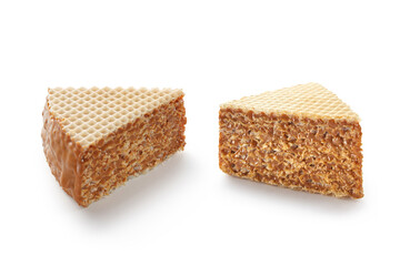 Two slices of waffle cake with caramel or condensed milk isolated on white