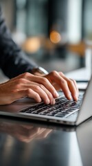 Close-up of hands typing on a laptop (4)