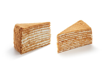Two slices of freshly baked tasty honey cake isolated on white background