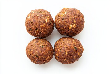 Four golden brown falafel balls a delicious Middle Eastern treat photographed against a bright white background