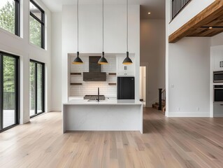 Highend twostory loft house with an openconcept marble kitchen, recessed LED lighting, and a contemporary fireplace