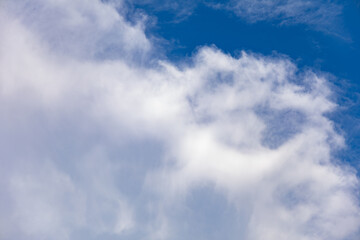 Blue Sky Filled with Fluffy White Clouds