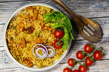 Mixed fried rice with cherry tomotos, lettuce and onions 