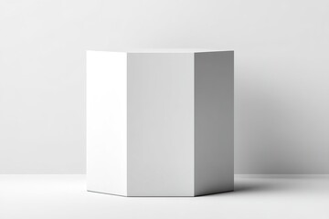 Naklejka premium Modern geometric white pedestal displayed in a minimalist interior during daylight, creating an elegant focal point