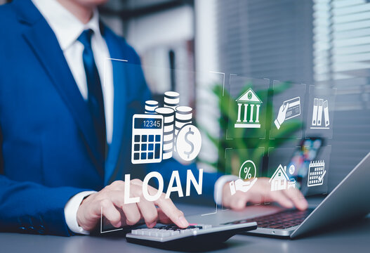 Personal Loan Calculation and Financial Planning Concept. Businessperson using calculator and laptop with digital loan icons, representing personal loans, interest rates, financial management tools,