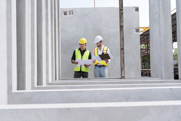 Engineer, Teamwork, Construction site. Team of male engineer construction working and inspecting...