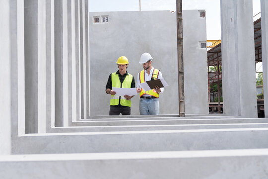 Engineer, Teamwork, Construction site. Team of male engineer construction working and inspecting structure of building at construction site. Construction builder control of work at site work