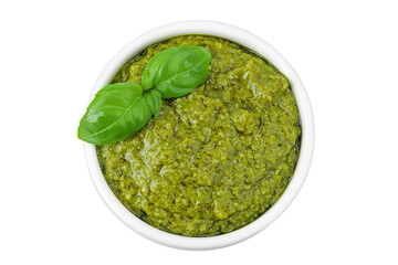 Pesto sauce in ceramic bowl isolated on white background. Top view. Flat lay.