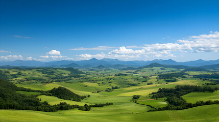Obraz premium Panoramic View Of Lush Green Valley With Mountains