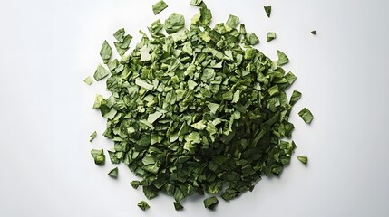 A pile of chopped fresh spinach leaves isolated on a white background. The spinach is vibrant green and appears to be freshly chopped.
