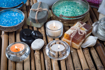 Spa massage items are arranged in a composition on the table.