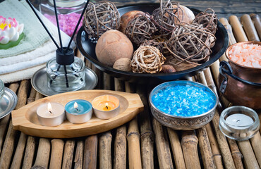 Spa massage items are arranged in a composition on the table.