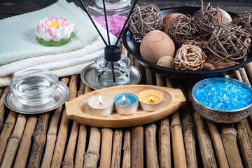 Spa massage items are arranged in a composition on the table.