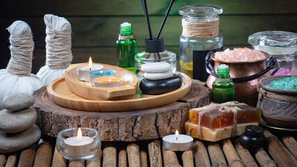Spa massage items are arranged in a composition on the table.
