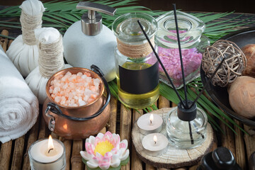 Spa massage items are arranged in a composition on the table.