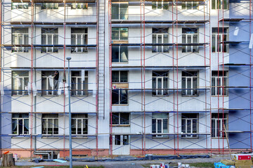 Renovation of a residential building facade demonstrates the craftsmen's skill and dedication to detail.