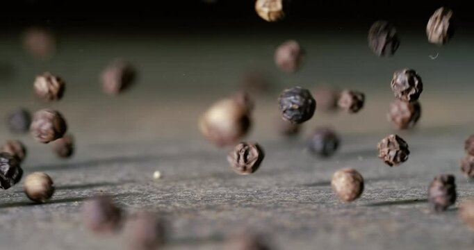 Peppercorns or black pepper spice. Super Macro Close Up. Shot on super slow motion camera 1000 fps.