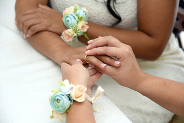 Lesbian Couple Exchanging Wedding Rings in a Community Ceremony