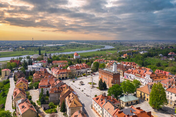 Fototapeta premium Summer skyline cityscape of Sandomierz, Świętokrzyskie, Poland. Wide panoramic aerial view of the old town at sunset