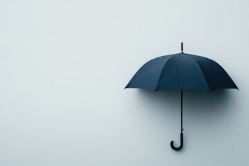 Umbrella hanging on a wall during a rainy day in an indoor setting