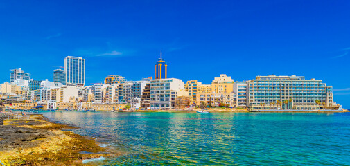 Obraz premium Cityscape of St Julian's Bay and skyscrapers in Paceville distric, Malta