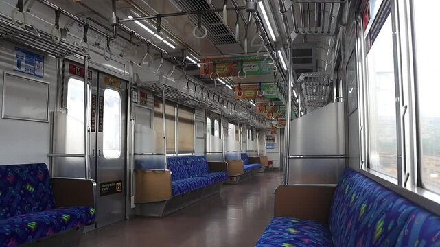 The atmosphere of a quiet KRL commuter line train carriage without any passengers will move to the next station. Jakarta - Indonesia 04 04 2025