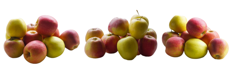 Red and yellow apples stacked on a white background