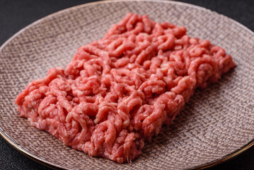 Stuffing or ground raw beef or pork with salt and spices