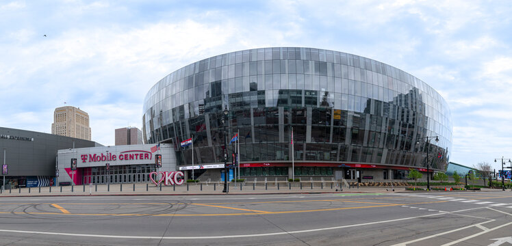 Kansas City, MO USA - April 14th 2025: Wide panoramic shot of the T Mobile Center in downtown KC.  Large round glass arena with striking exterior appearance.  Main entrance side.