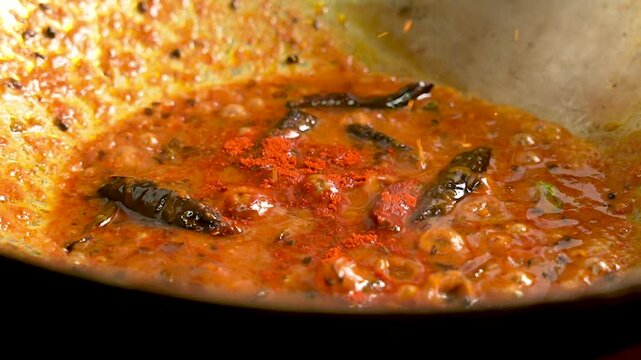 Red Chilli Powder Sprinkled over Curry