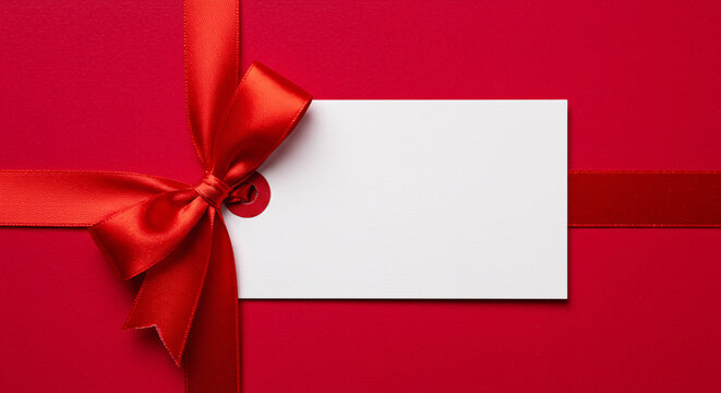 Blank White Gift Tag with Red Ribbon Bow &ndash; Festive Holiday Greeting or Wrapping Element

