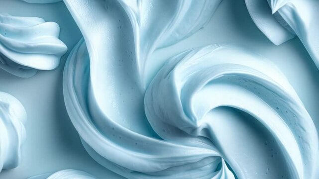 Whipped cream patterns in soft blue color create a visual feast for dessert lovers