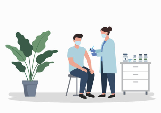Healthcare worker administering a vaccine to a patient wearing a face mask. Immunization and vaccination concept