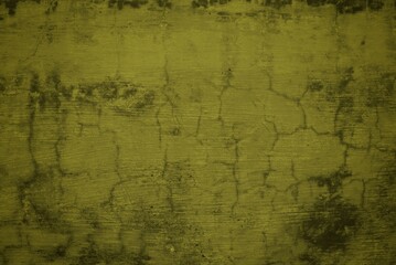 Obraz premium cracked wall background with yellow rays, Background with an old concrete wall with an orange cracked paint lit by sun rays