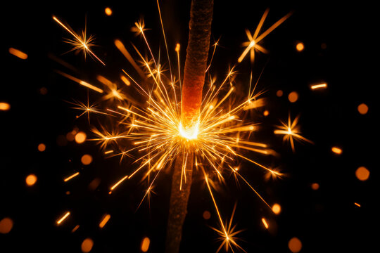 Close-up of sparkler burning in the dark