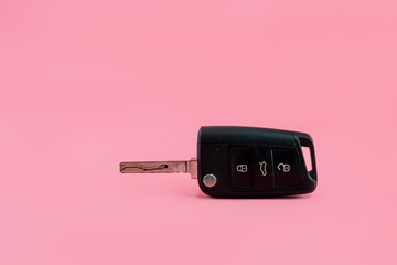 Car keys on pink isolated background