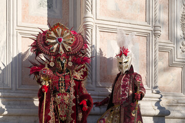 Venice, Italy - People dressed in carnival masks are photographed by tourists in the scenery of the...