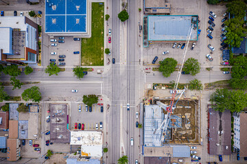 City street view with a crane in the middle of the intersection