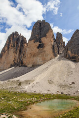 Tre Cime di Lavaredo landscape with blue sky and clouds