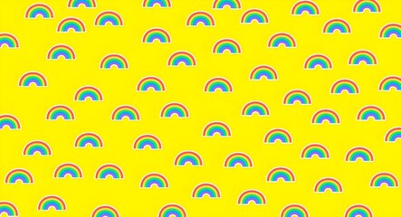 Seamless rainbow pattern on yellow background, rainbow icons or symbols for background or wallpaper, rainbow background