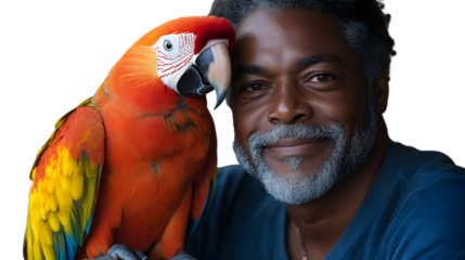 Senior man with a colorful macaw parrot