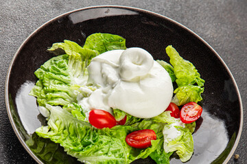 Burrata cheese salad buffalo milk cheese salad dish fresh delicious gourmet food background on the table rustic food top view copy space keto and paleo diet vegetarian