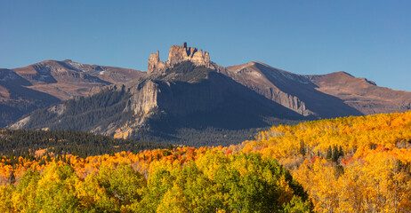 Rising above a sea of autumn color, The Castles (12,296') are one Colorado's most unique rock...