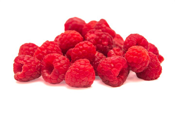 Heap of raspberries on white isolated background