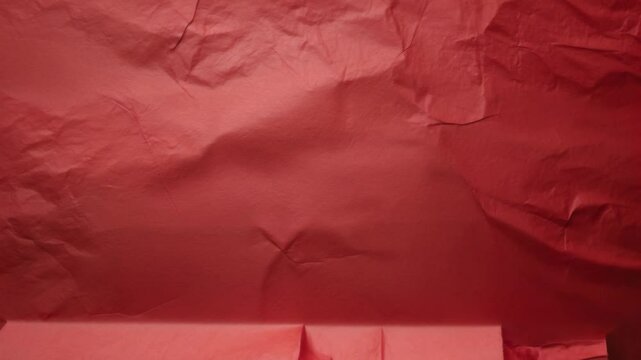 Red paper texture or background with space for design, text, or video