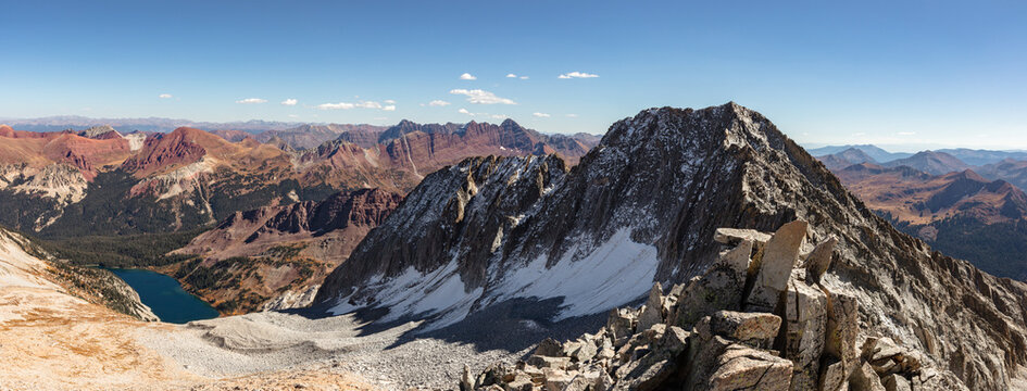 Haggerman Peak (13,848') and brilliant blue Snowmass lake captured from the ridge of Colorado 14er Snowmass Mountain (14,105') on a clear autumn day.