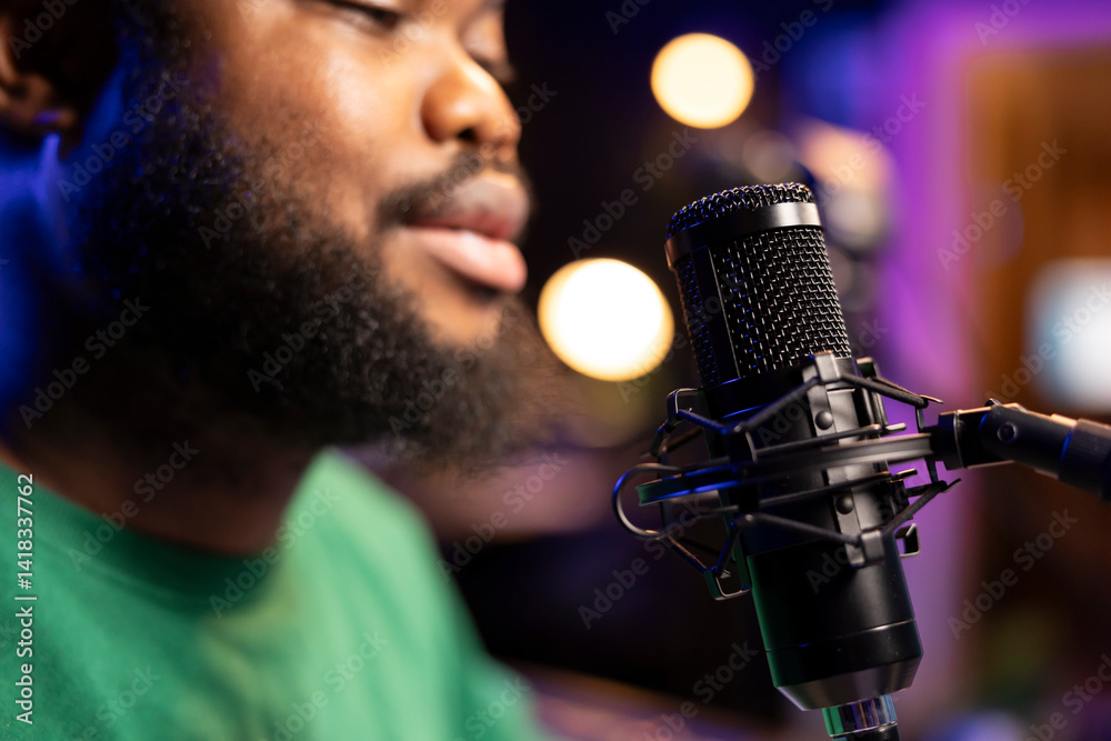 Leinwandbilder singer performing his new track creation on a microphone, manipulates his audio files recordings wit
