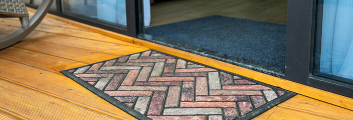 The rug in front of the door
