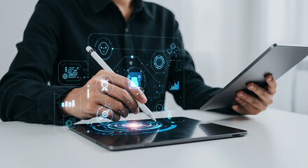 Business concept images, clear concept, valuable images  a person using a stylus on a tablet with digital interface overlays and holding another tablet device