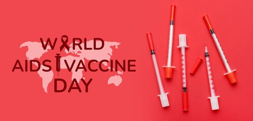 Many syringes on red background. World AIDS Vaccine Day